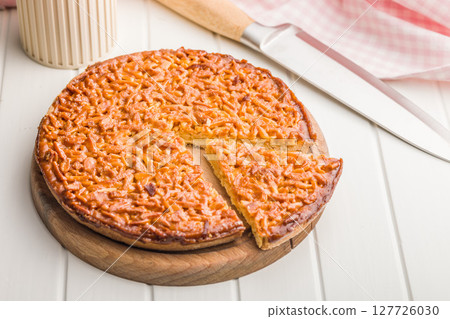 Sweet almond pie on white table. 127726030