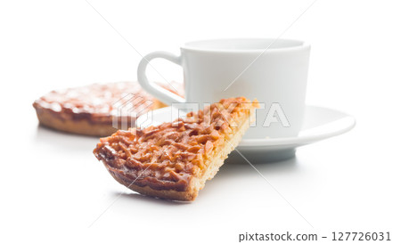 Sweet almond pie and coffee cup isolated on white background. 127726031