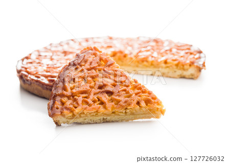 Sweet almond pie isolated on white background. 127726032