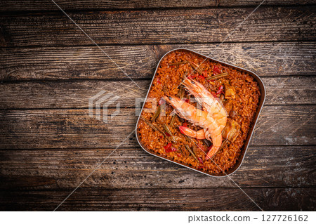 Spanish paella in a metal plate 127726162
