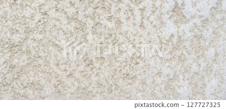 Rough concrete wall texture creating interesting background Rough concrete wall texture creating interesting background 127727325