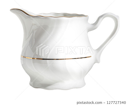 White porcelain creamer with gold details on transparent background 127727340