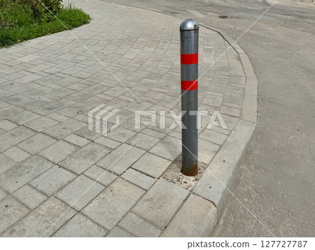 parking poles are gray-red on a warm summer day. High quality photo 127727787