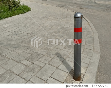 parking poles are gray-red on a warm summer day. High quality photo 127727789