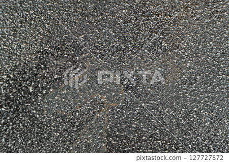 Rust stains on cast iron surface, macro 127727872