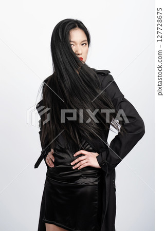 Asian woman in burberry skirted trench coat and long black hairs 127728675