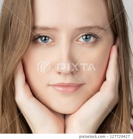 Beautiful long hair brunette woman studio portrait in white background Beautiful long hair brunette woman studio portrait in white background 127729427