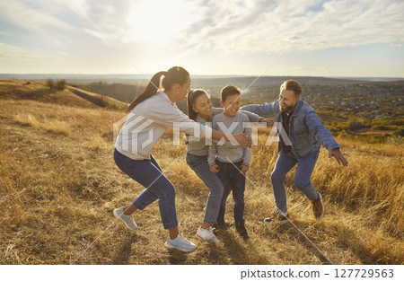 Happy playful family nature outdoor rest, spending weekend holiday together, parents, children 127729563