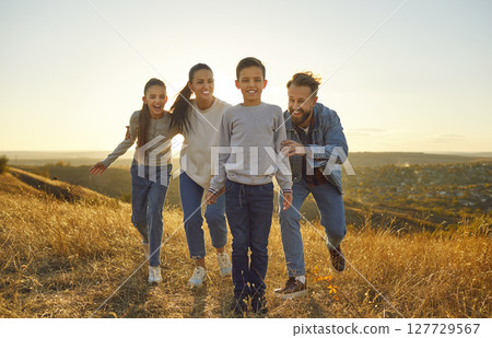 Parents and Children Enjoying Nature on a Relaxing Vacation Weekend 127729567