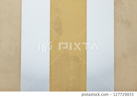 Vertical gold, white and beige striped wallpaper sample for elegant modern interiors Vertical gold, white and beige striped wallpaper sample for elegant modern interiors 127729833