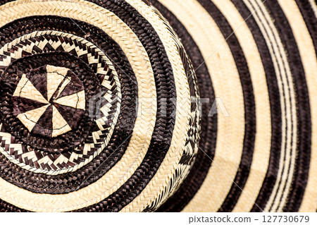 Traditional hat from Colombia called Sombrero vueltiao. Colombian concept. Colombian culture concept. Background Traditional hat from Colombia called Sombrero vueltiao. Colombian concept. Colombian culture concept. Background 127730679