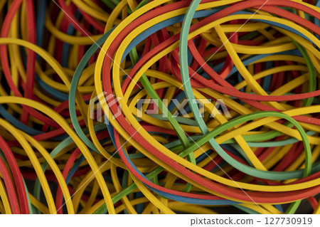 rubber bands for money, rubber bands of different colors for packaging and organizing paper money, closeup 127730919