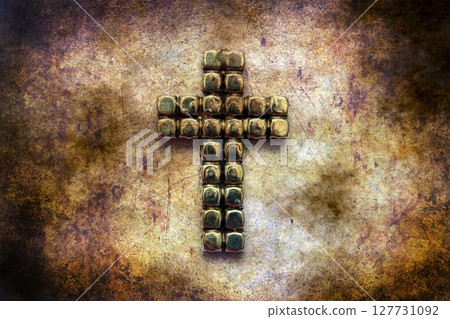 Metal cross on grunge background Metal cross on grunge background 127731092