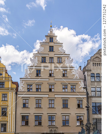 Historic Gabled Building Architecture Against a Vibrant Blue Sky Wroclaw, Poland Historic Gabled Building Architecture Against a Vibrant Blue Sky Wroclaw, Poland 127731242