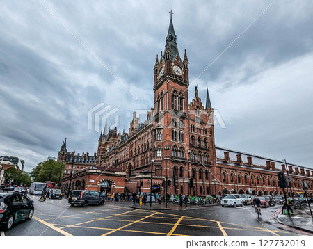 A tower of St Pancras International Railway Station against cloudy sky. London, UK. A tower of St Pancras International Railway Station against cloudy sky. London, UK. 127732019