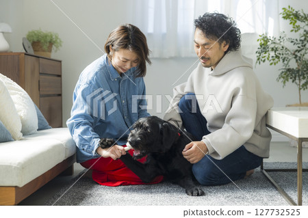 Couple with pet dog 127732525