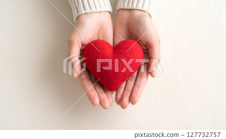 Women's hand with red heart 127732757