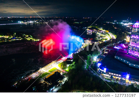 Niagara Falls frozen at night with colorful lights Niagara Falls frozen at night with colorful lights 127733197