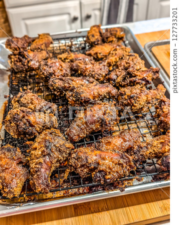 chicken wings appetizer on baking tray 127733201