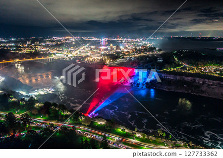Niagara Falls frozen at night with colorful lights Niagara Falls frozen at night with colorful lights 127733362