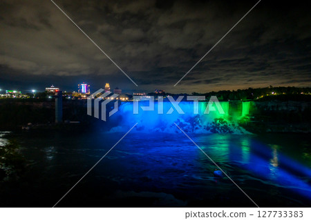 Niagara Falls frozen at night with colorful lights 127733383