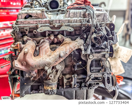 complex engine work in auto shop 127733404