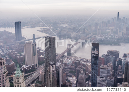 New York City Manhattan midtown aerial panorama view with skyscrapers and cloudy day. New York City Manhattan midtown aerial panorama view with skyscrapers and cloudy day. 127733540