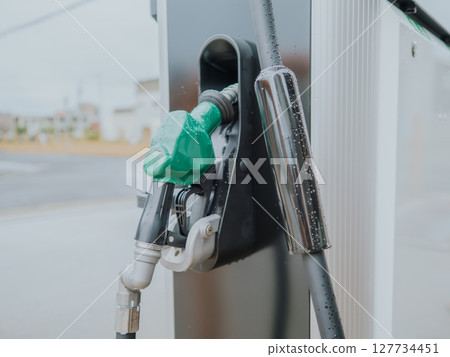 Green nozzle for diesel at a gas station Green nozzle for diesel at a gas station 127734451