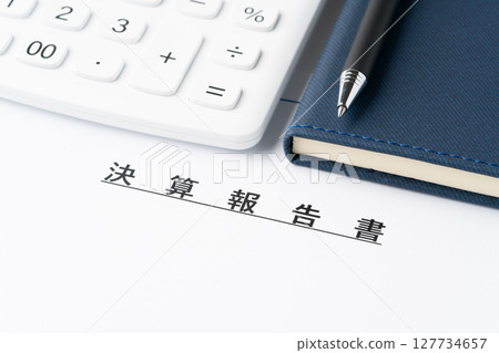 Calculator, notebook and financial statement 127734657