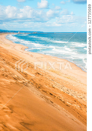 A view of the Tottori Sand Dunes in Tottori Prefecture with blue skies and clouds A view of the Tottori Sand Dunes in Tottori Prefecture with blue skies and clouds 127735089