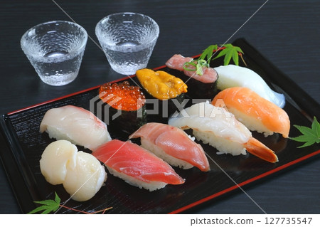 Nigiri sushi and cold sake 127735547