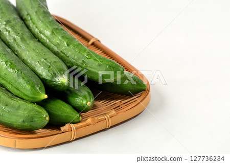 Cucumbers stacked in a colander Cucumbers stacked in a colander 127736284