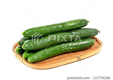 Cucumbers stacked in a colander Cucumbers stacked in a colander 127736286
