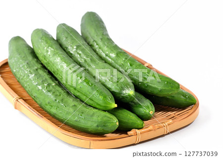 Cucumbers stacked in a colander 127737039