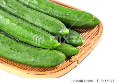 Cucumbers stacked in a colander 127737041