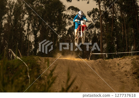 Enduro bike rider 127737618