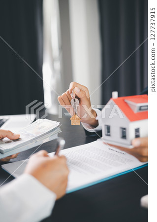 Concept business house finance protection office plan investment buy sell home ensuring idea financial security. residence agent hand protect purchase insurance and secure favorable loan deal. 127737915