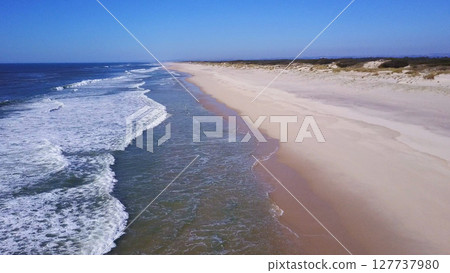 Low flying along sand beach shore Low flying along sand beach shore 127737980