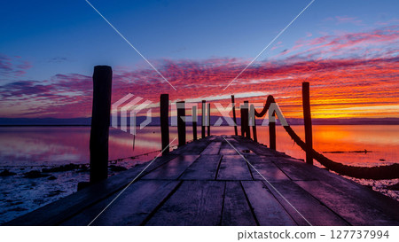 Sunrise of a wooden pier Sunrise of a wooden pier 127737994