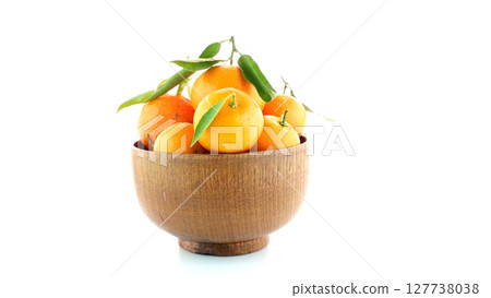 Tangerines on wooden bowl Tangerines on wooden bowl 127738038