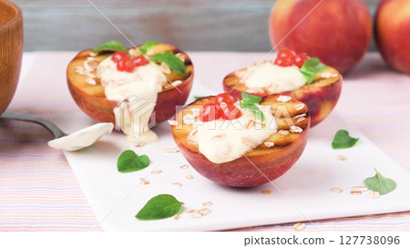 Grilled peaches dessert Grilled peaches dessert 127738096