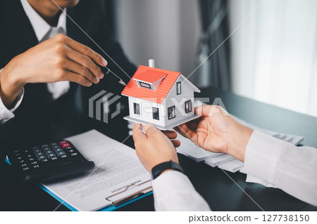 Concept business house finance protection office plan investment buy sell home ensuring idea financial security. residence agent hand protect purchase insurance and secure favorable loan deal. 127738150