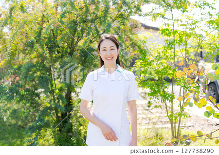 Portrait of a woman in a white coat Portrait of a woman in a white coat 127738290