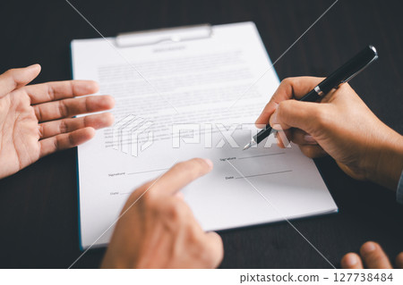Business people signing contract making deal with life insurance agent Concept for consultant health insurance life insurance savings plan. Approved stamp with Business people contract making deal 127738484