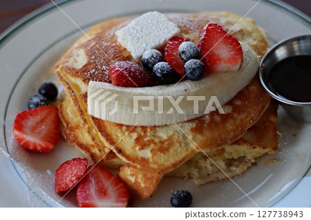 Pancakes with lots of fruit 127738943