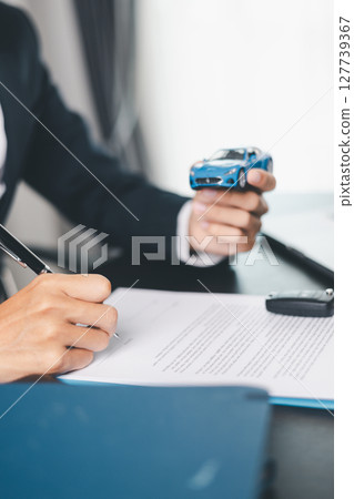 Concept business vehicle finance protection office plan investment buy sell car ensuring idea financial security. automobile agent hand protect purchase insurance and secure favorable loan deal. 127739367