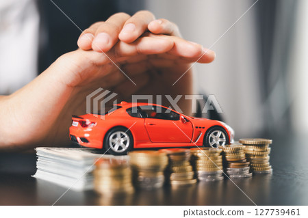 Concept business vehicle finance protection office plan investment buy sell car ensuring idea financial security. automobile agent hand protect purchase insurance and secure favorable loan deal. 127739461