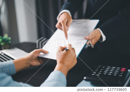 Business people signing contract making deal with life insurance agent Concept for consultant health insurance life insurance savings plan. Approved stamp with Business people contract making deal Business people signing contract making deal with life insurance agent Concept for consultant health insurance life insurance savings plan. Approved stamp with Business people contract making deal 127739605