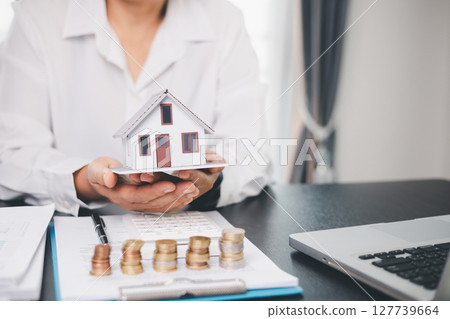 Concept business house finance protection office plan investment buy sell home ensuring idea financial security. residence agent hand protect purchase insurance and secure favorable loan deal. 127739664