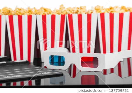 Popcorn boxes with 3D glasses and clapperboard 127739761